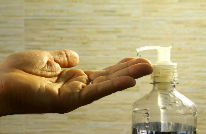 sanitizer in a glass bottle