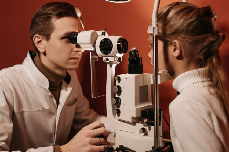 Ophthalmologist with young patient